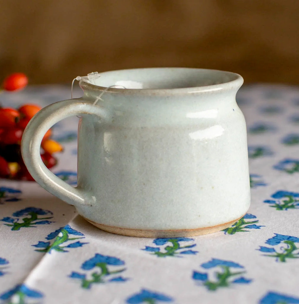 white and slight beige speckle glazed ceramic mug 