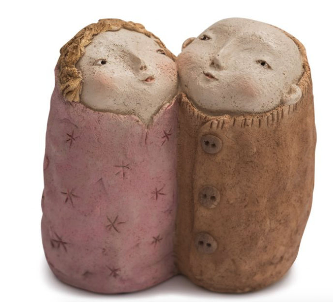 hand painted resin twins (man and woman) in brown and pink.