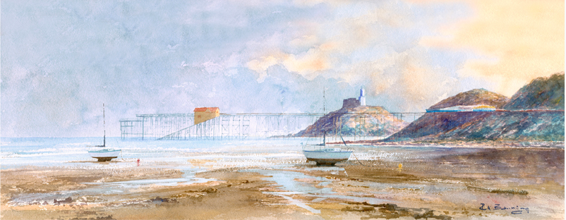 Print of Mumbles Pier in the evening at low tide, with two beached boats in the foreground.