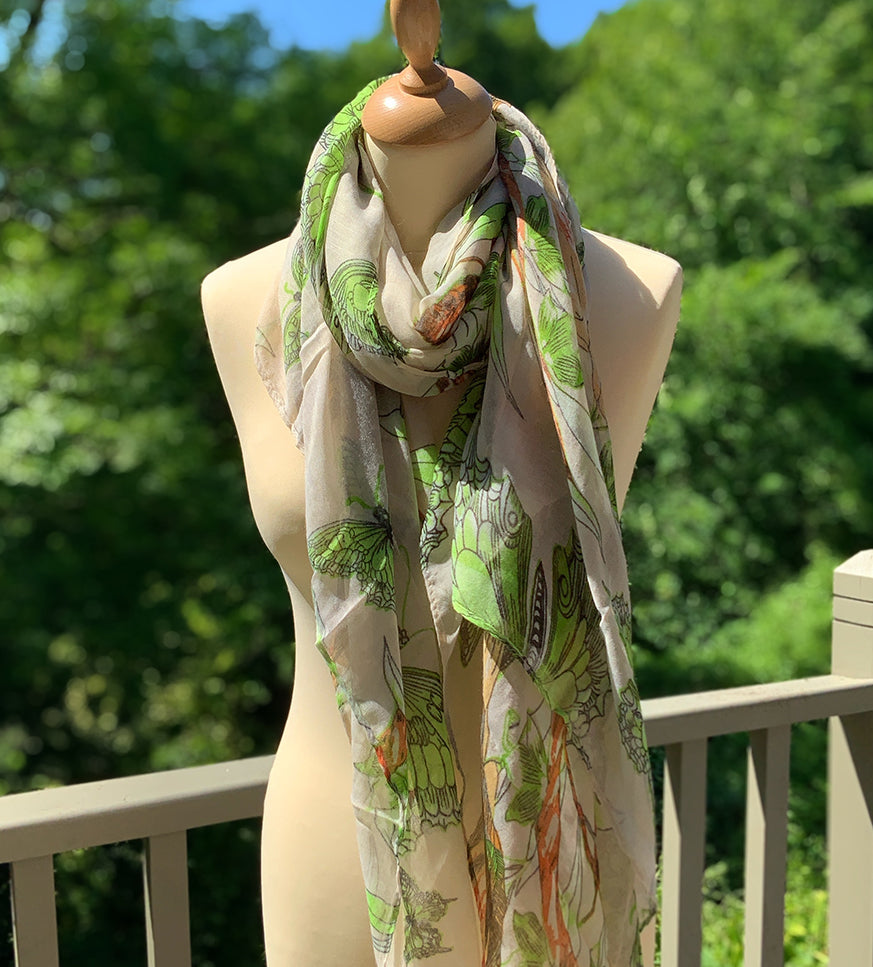 cream summer scarf with a lime green butterfly pattern with orange accents