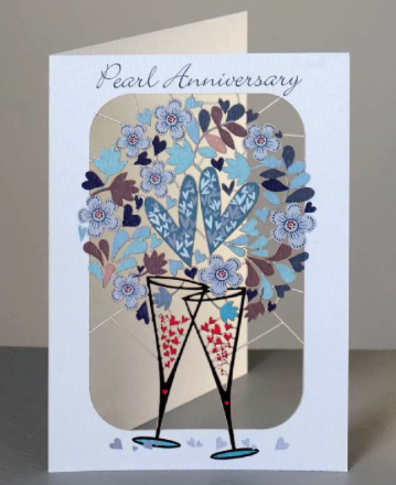 Pearl anniversary greetings card with lasercut champagne glasses and hearts. 