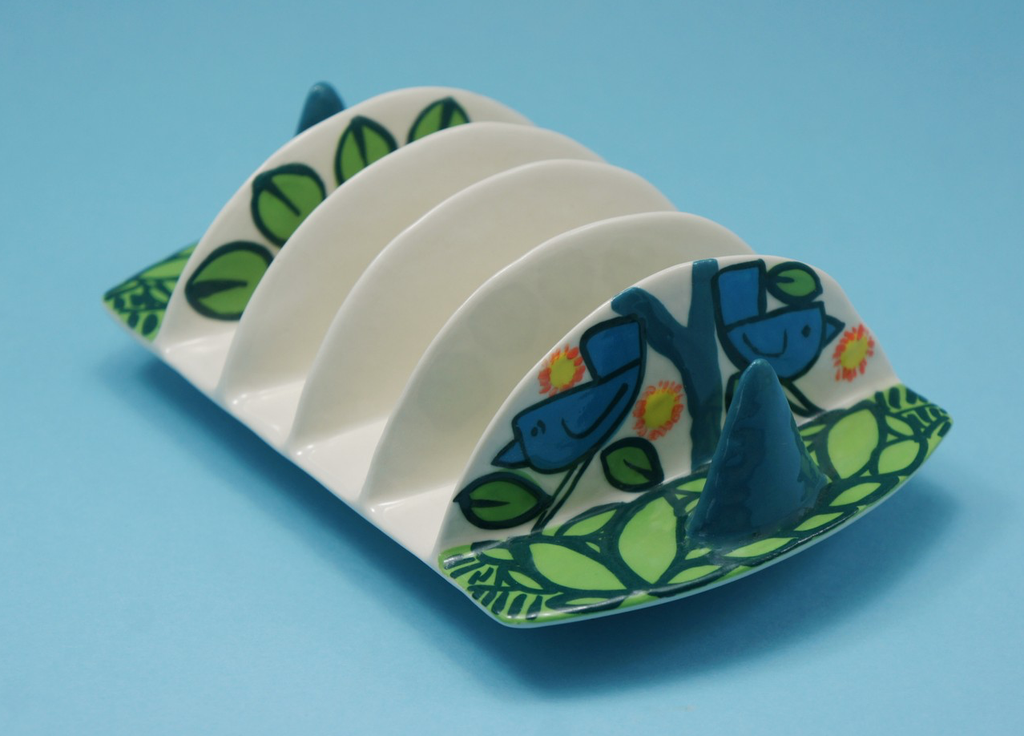 Toast rack with blue birds and green leaves design.