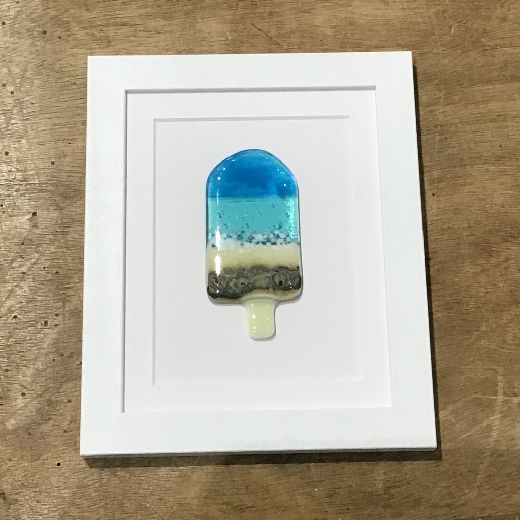 Framed glass ice lolly in aqua blue.