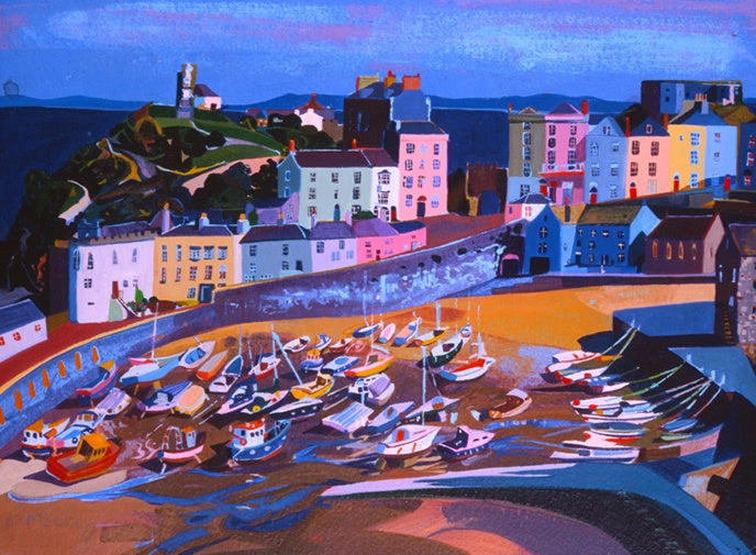 Tenby harbour with boats beached on the sand below the sea wall and brightly coloured Victorian houses . Painted in watercolour.