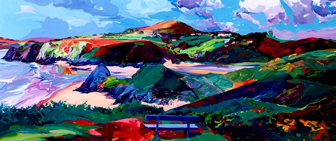 Three Cliffs Bay from the clifftops with a bench in the foreground painted by Michele Scragg.  