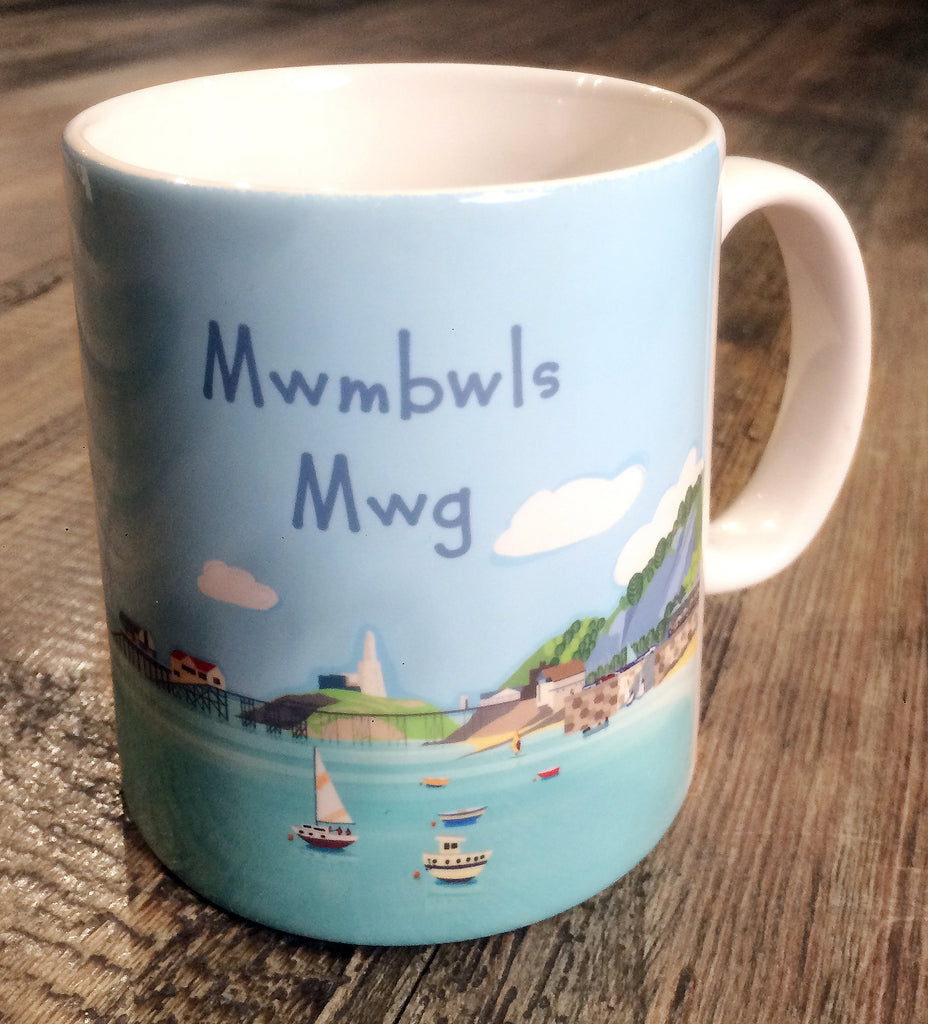 Mug with an illustration of Mumbles Headland and the text Mwmbwls Mwg.