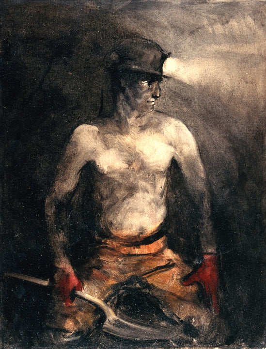 Man working at a coal face topless with illuminating headgear, shovel and red gloves.