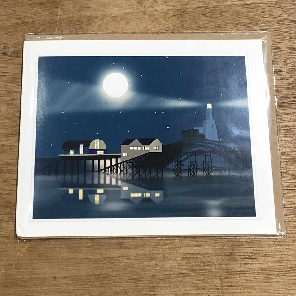 Greetings card with an illustrated Mumbles lighthouse at night.