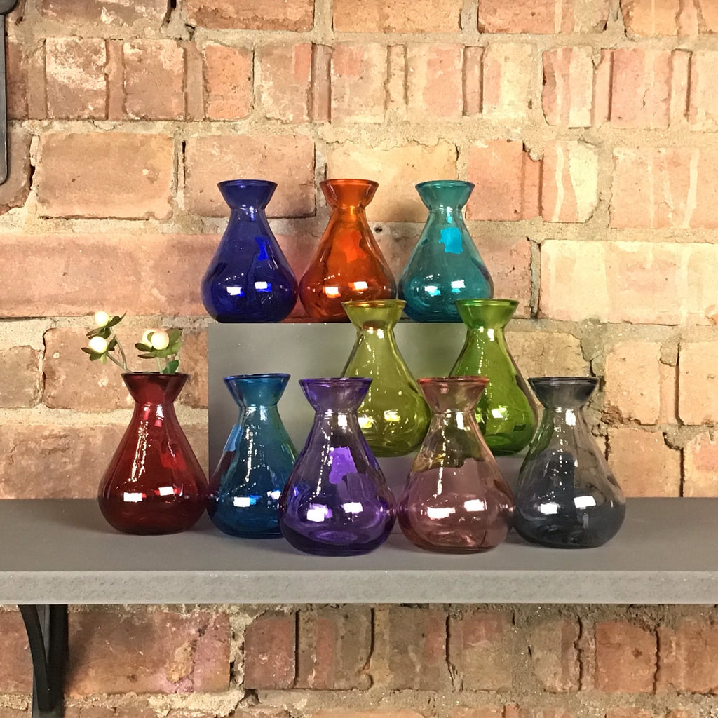 Group of different coloured glass bud vases