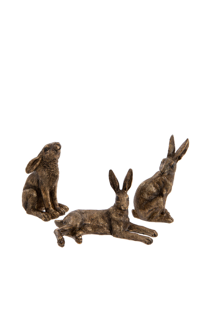 Mini antique gold hares that come in three posses, laying, sitting and moon gazing
