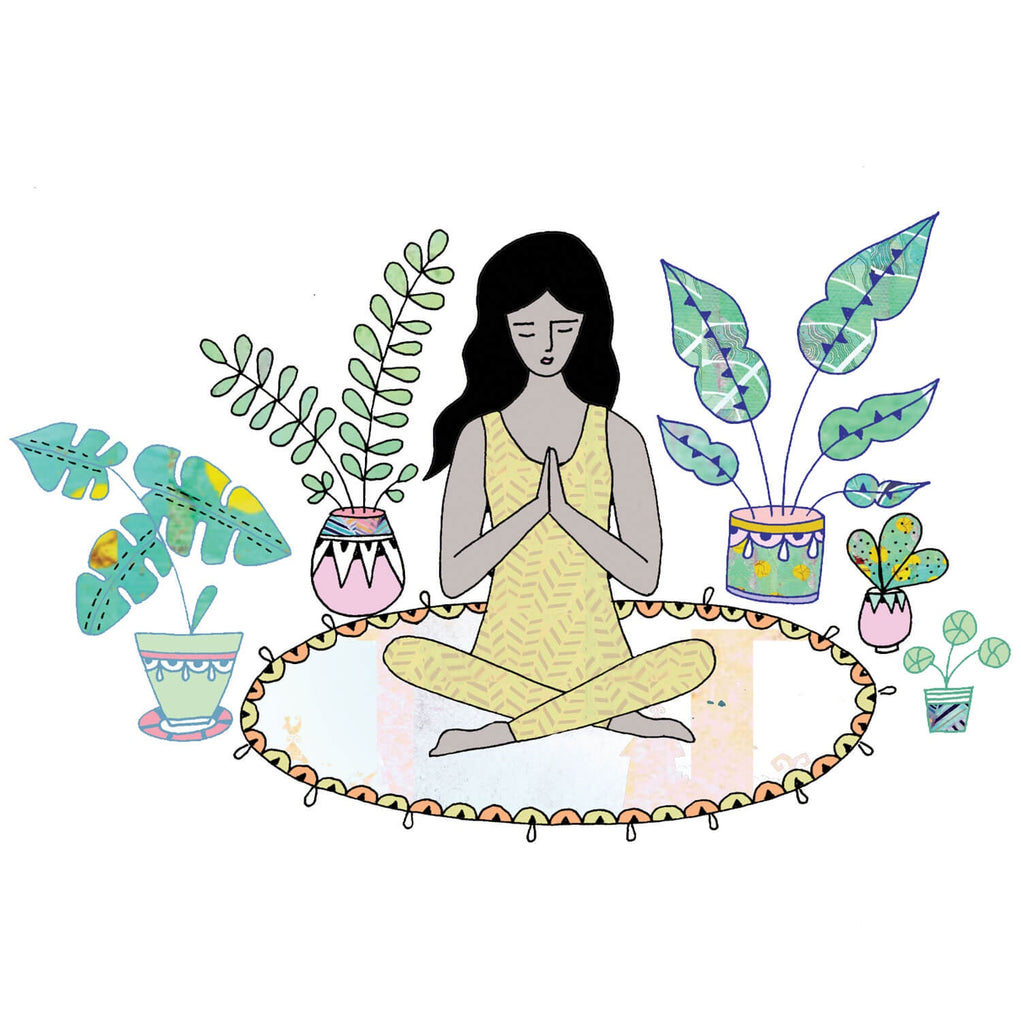 Greetings card with a woman practicing yoga on a mat surrounded by plants.