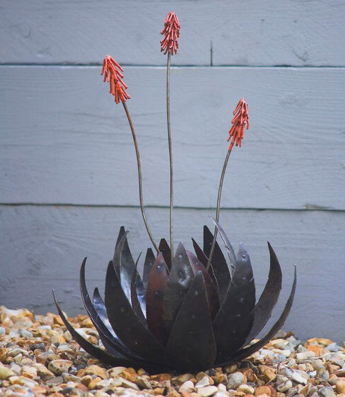 Metal flower sculpture with Aloe leaves and pink flowers