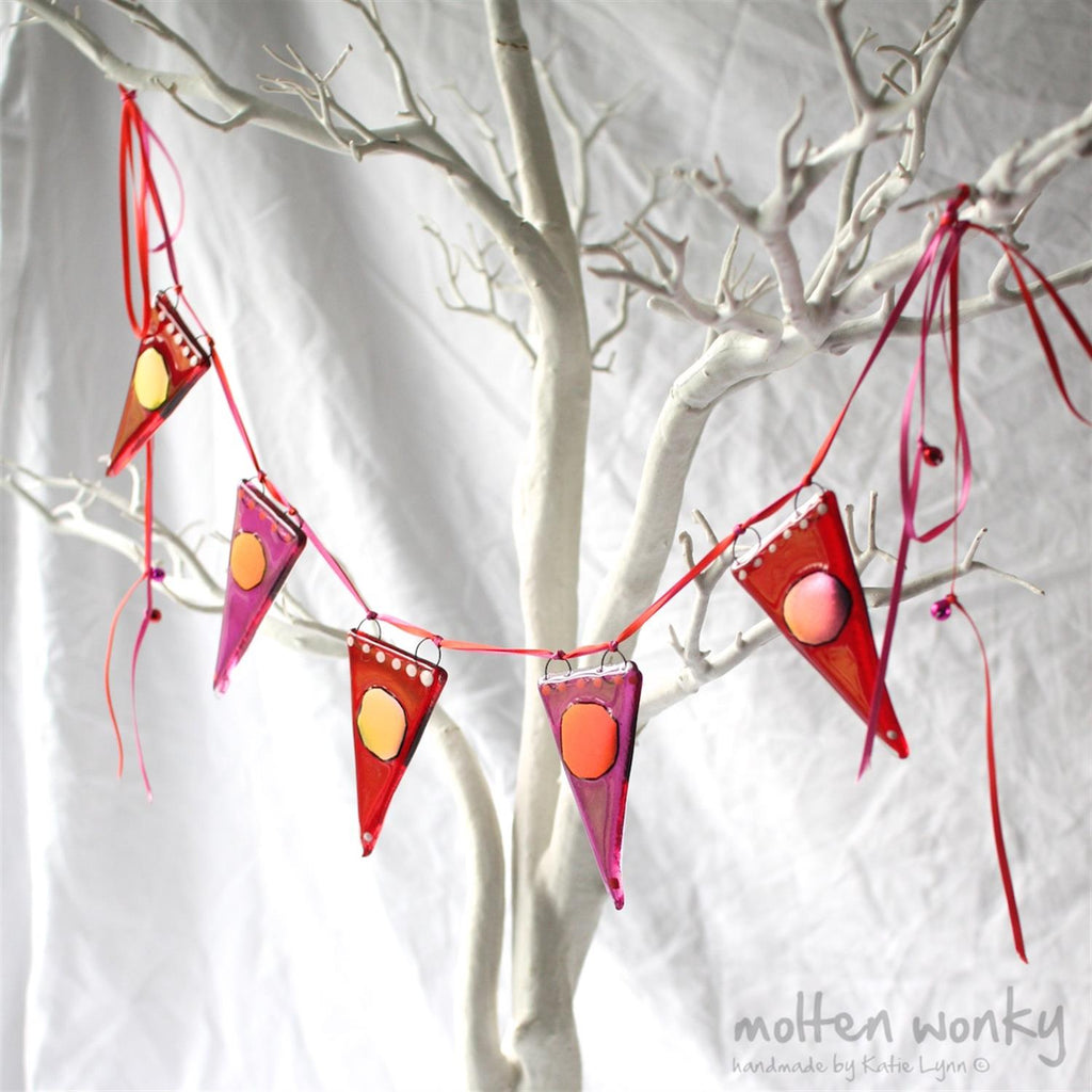 Glass bunting with red and pink design.